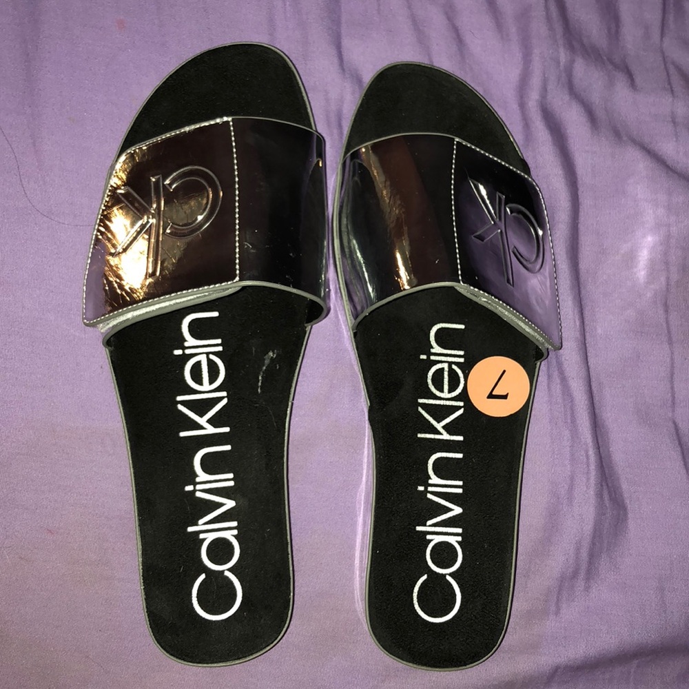 Silver Calvin Klein slides